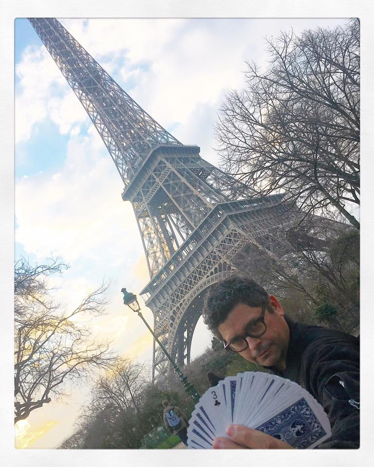 Three of Clubs: Is this your card? My boyfriend in front of the Eiffel Tower.